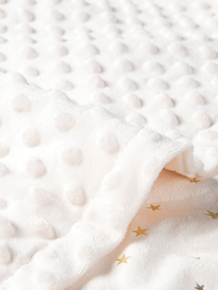 Couverture d'emmaillotage bébé blanche motifs étoiles